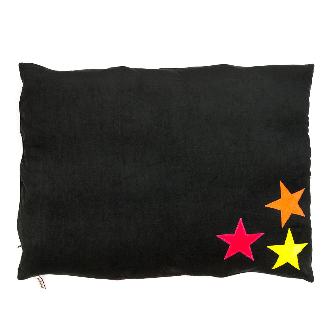 Black pillow with colorful stars on a white background