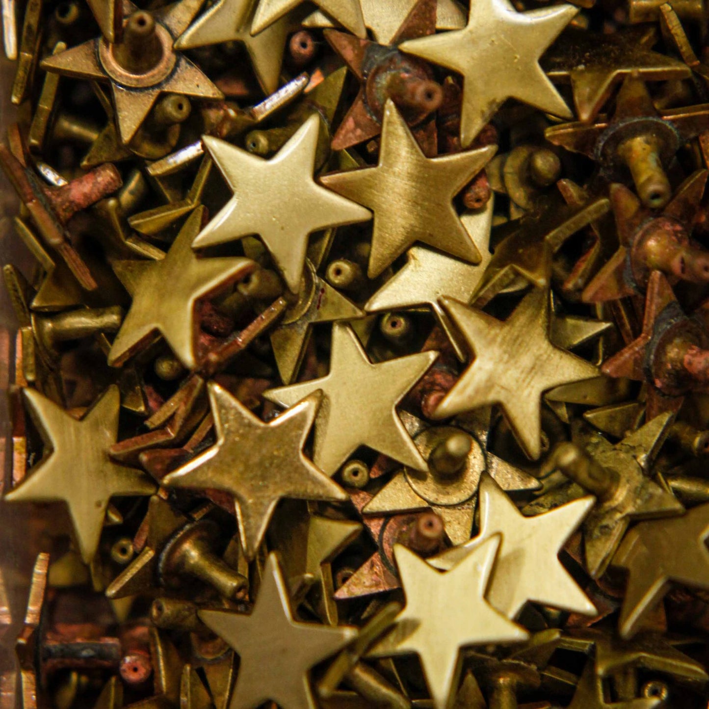 brass star studs for dog collars in our workshop, Creature Clothes