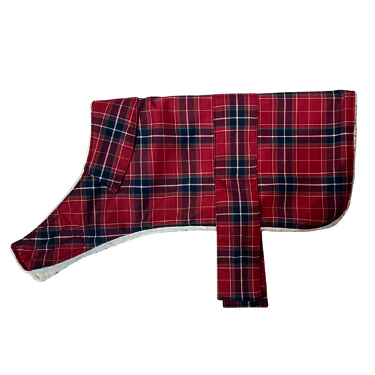 Red and blue plaid dog coat on a white background