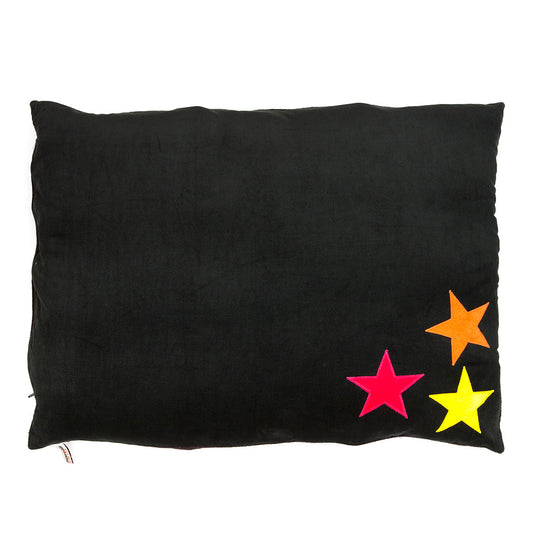 Black pillow with colorful stars on a white background