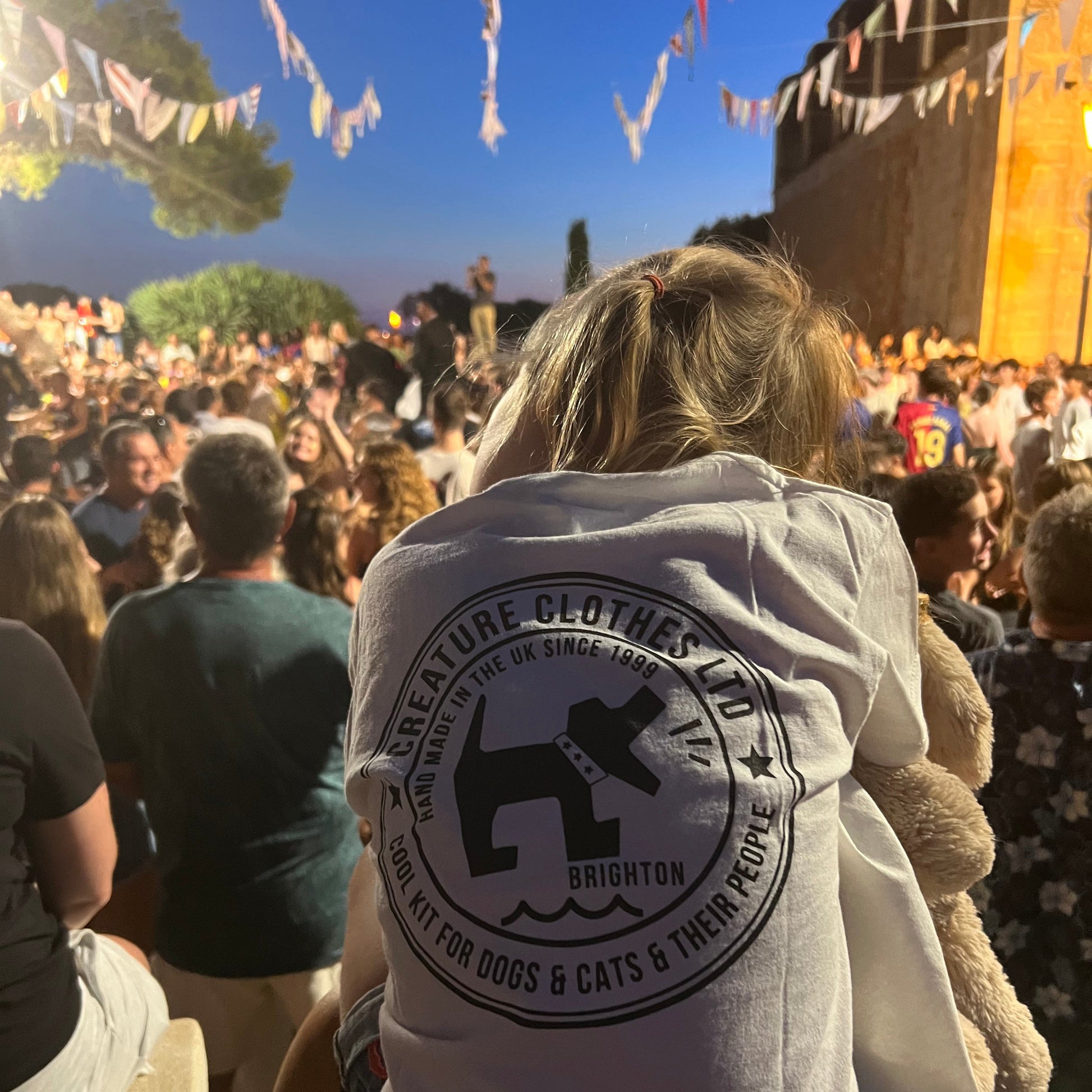 Creature Clothes Tshirt back print in a crowd of people