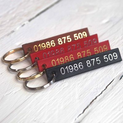 Personalised red, tan, choc and black leather id tags embossed with your telephone number