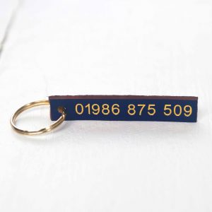 Personalised indigo leather key fob embossed phone number gold