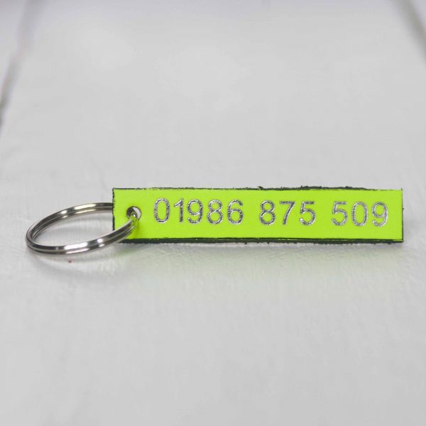 Personalised neon yellow leather key fob embossed phone number silver