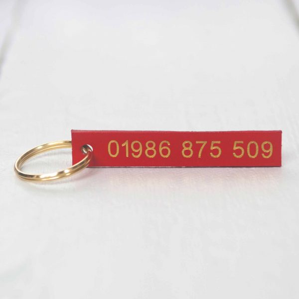 Personalised red leather key fob embossed phone number gold