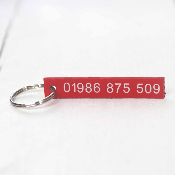 Personalised red leather key fob embossed phone number silver